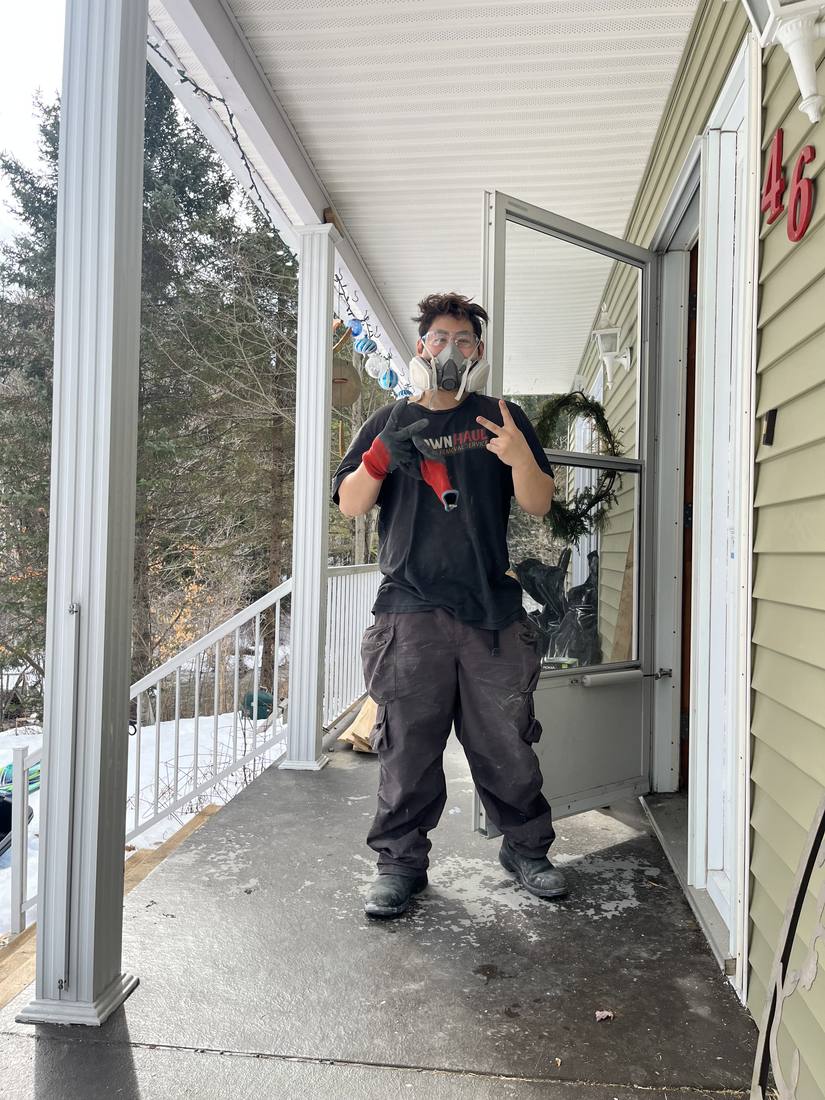 Crew member in a half-face respirator and safety glasses